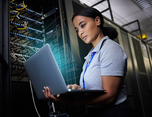 IT expert working on server rack