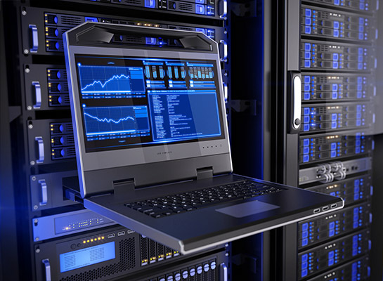 Laptop interface in server room among server racks