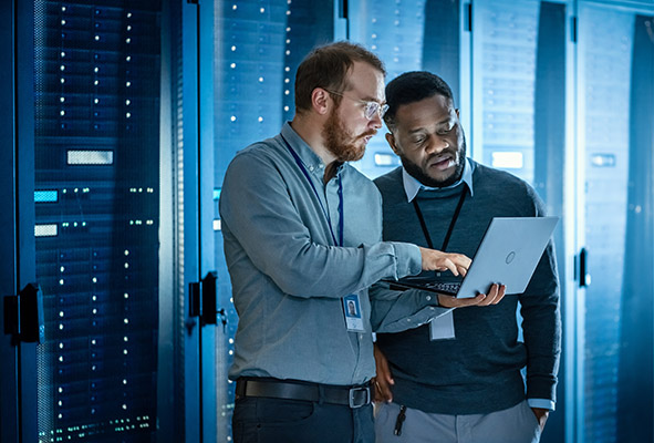 IT engineers optimizing network traffic